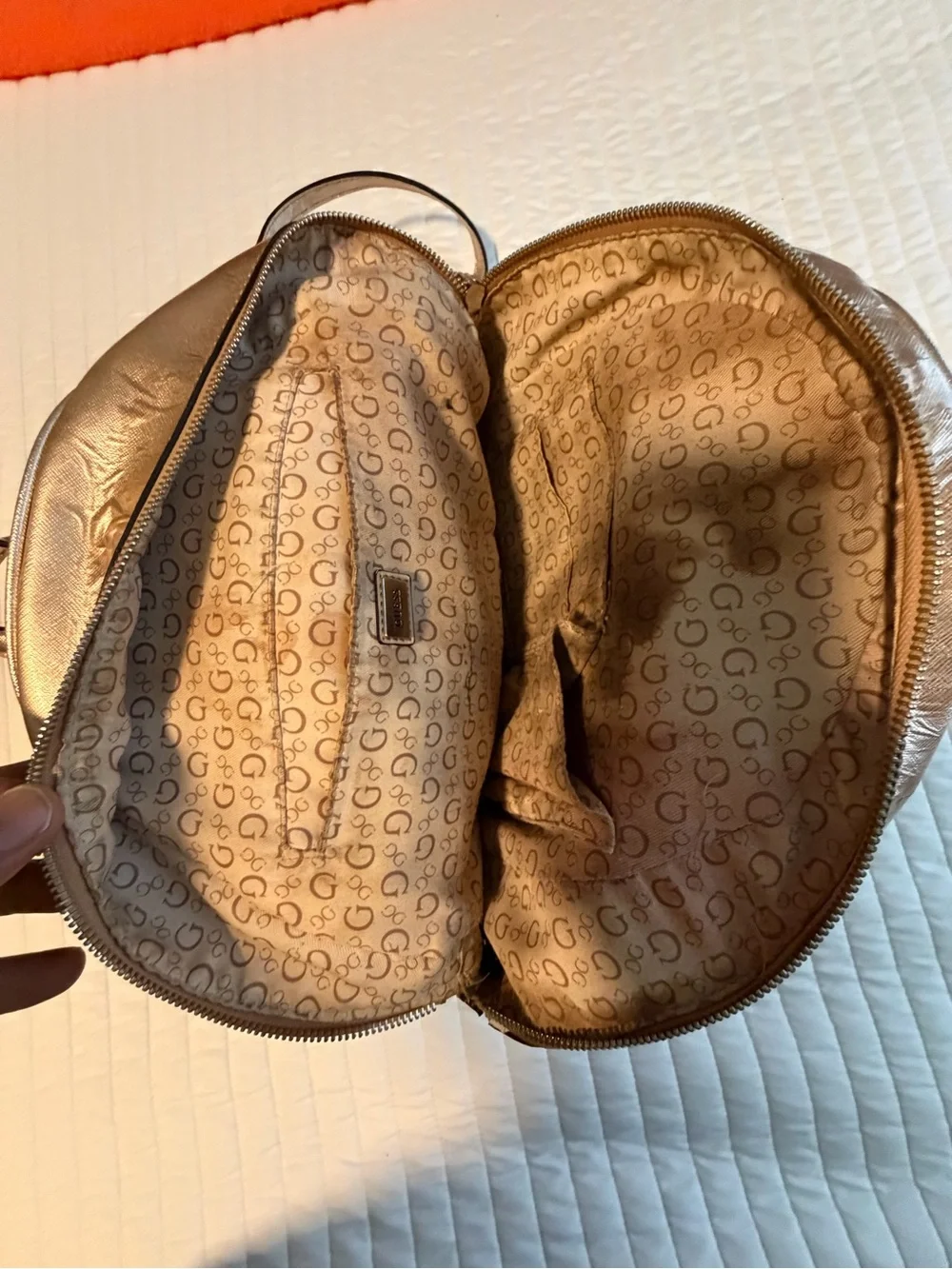 GUESS Metallic Gold Logo Backpack with Flower Charm